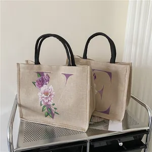 Jute-Einkaufstaschen mit lila Blumen-Alphabet V und E Designs und schwarzen Griffen