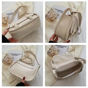 Detailed views of beige leather shoulder bag with magnetic flap and buckle ornament