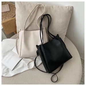 Minimalist large PU leather tote bag in beige and black colors for women