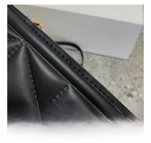 Detail of premium black quilted leather bag showing precise double-needle stitching and texture