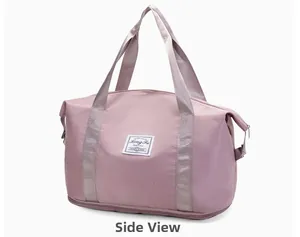 Side view of large pink travel bag with waterproof fabric and expansion zipper detail