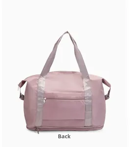 Back view of lotus pink travel bag with trolley sleeve and waterproof storage compartment