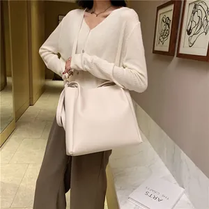 Minimalist beige leather tote bag with large capacity and sleek matte finish for women