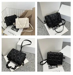 Quilted crossbody bag detail featuring geometric stitching and chic chain strap