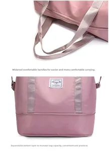 Pink travel bag detail showing widened comfortable handles and expandable bottom layer