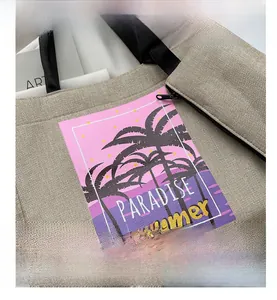Close-up of linen tote bag fabric showing sunset palm tree print and black zipper