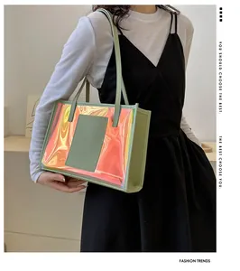 Chic holographic PVC tote bag with lime green trim worn on a model's shoulder