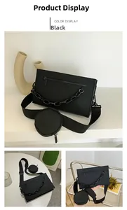Detail view of black square crossbody bag with thick chain and round coin purse