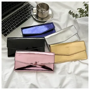 Envelope wallets in metallic finishes including blue, silver, and gold with sleek stitching