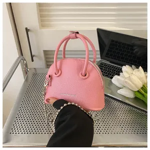 Pink litchi grain mini shell bag with metal chain strap and top handles for women