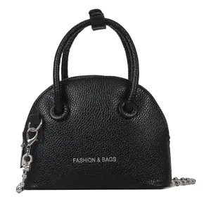 Black lychee pattern mini shell bag with chain strap and silver bead charm accessories