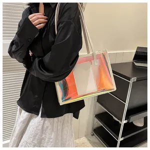 Close-up of PVC laser tote bag with iridescent gradient effect and cream leather trim