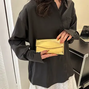 Minimalist envelope clutch bag in metallic gold finish for women summer fashion