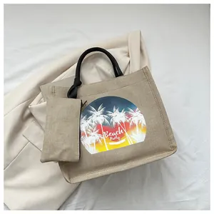 Detail of khaki jute tote bag with beach party print and black rope handles set