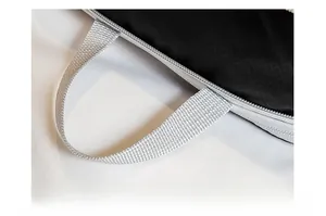 Close-up of black grid fabric travel organizer with durable grey handle and zipper