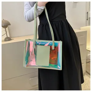Detailed view of mint green laser tote bag showing iridescent PVC texture and stitching