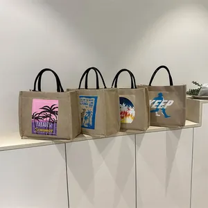 Set of four linen tote bags with summer beach prints and black webbing handles