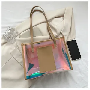 Macro view of holographic PVC tote bag with stylish khaki leather handles and inner slot