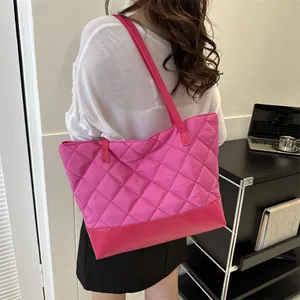 Chic magenta quilted tote bag with diamond pattern and faux leather bottom panel
