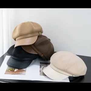 Classic newsboy caps in khaki, brown and black with textured fabric and leather brims