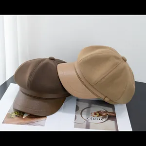 Retro patchwork baker boy caps in dark brown and camel with elegant matte leather brims