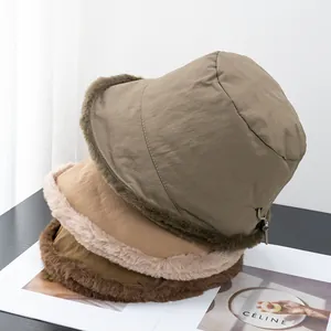 Fleece-lined bucket hats for winter in green, brown, and dark coffee with fur trim