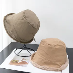 Close-up of winter fleece bucket hat with adjustable metal buckle and warm fur lining