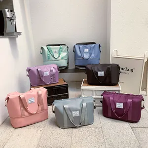 Multi-color waterproof nylon travel bags with expandable base and fashion logo patch