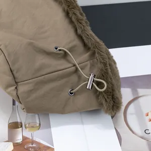 Close-up of winter bucket hat drawstring with faux fur trim and adjustable metal toggle