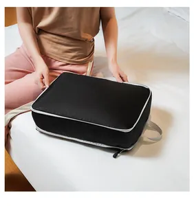 Detail of durable black nylon travel compression bag with reinforced zipper and handle