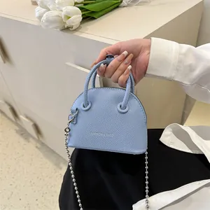 Light blue lychee pattern mini shell bag with silver ball chain and top handle