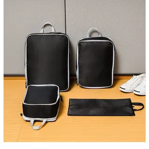 4-piece black travel compression organizers set for clothing, shoes, and toiletries