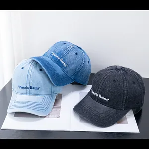Three vintage denim baseball caps with Pamela Raina embroidery in blue and grey washes