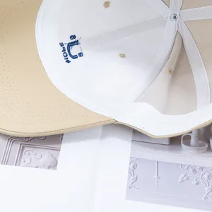 Detailed close-up of cotton twill baseball cap interior with embroidered blue logo