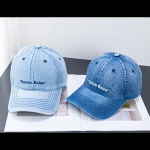 Vintage denim baseball caps with Pamela Raina embroidery in light and dark blue shades