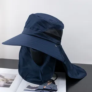 Detail of dark blue sun hat featuring a wide brim, face mask, neck flap and mesh vents