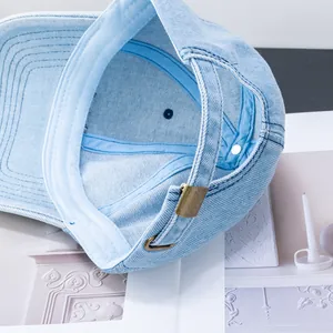 Adjustable light blue denim baseball cap with vintage metal buckle and washed fabric