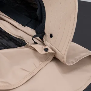 Detail of khaki outdoor sun hat with neck flap, breathable mesh lining, and snap buttons