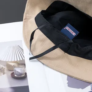 Khaki cotton linen bucket hat with checkerboard texture and adjustable inner ribbon