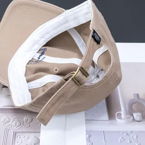 Khaki cotton baseball cap with adjustable metal buckle and soft crown embroidery