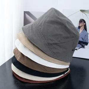 Foldable short brim bucket hat for women in various colors with adjustable drawstring cord