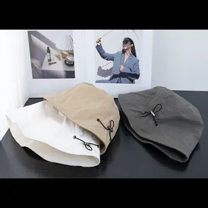 Foldable short brim bucket hats in beige, khaki and grey with adjustable elastic cords
