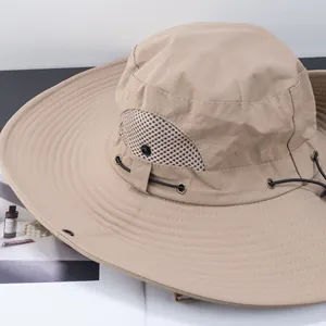 Detail of khaki sun hat with breathable mesh vents and adjustable drawcord for outdoors