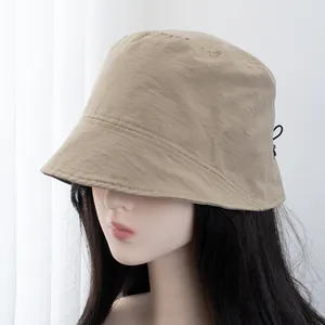 Detail of khaki sun hat with adjustable elastic drawstring for personalized fit