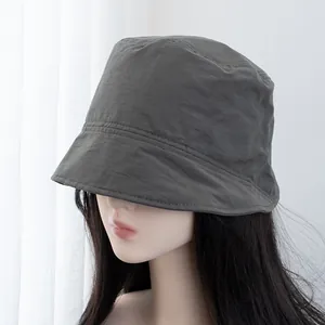 Close-up of dark grey bucket hat showing high-quality textured fabric and stitching detail