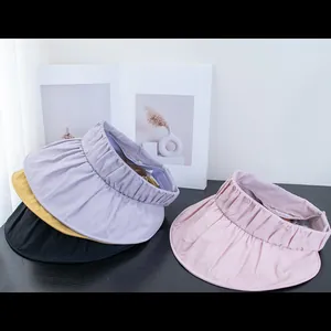 Foldable UV protection sun visor with wide pleated brim in purple, yellow, black and pink