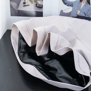 Detailed macro view of the double-layered brim with black vinyl lining and beige fabric