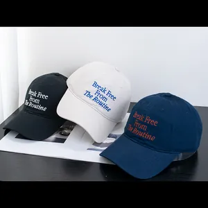 Set of three cotton baseball caps with Break Free embroidery in black, cream, and navy blue