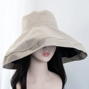 Detail view of khaki sun hat with wide brim and black vinyl UV protection lining