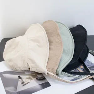 Detailed grid of quilted bucket hats in beige, khaki, light green, and black with wind ropes